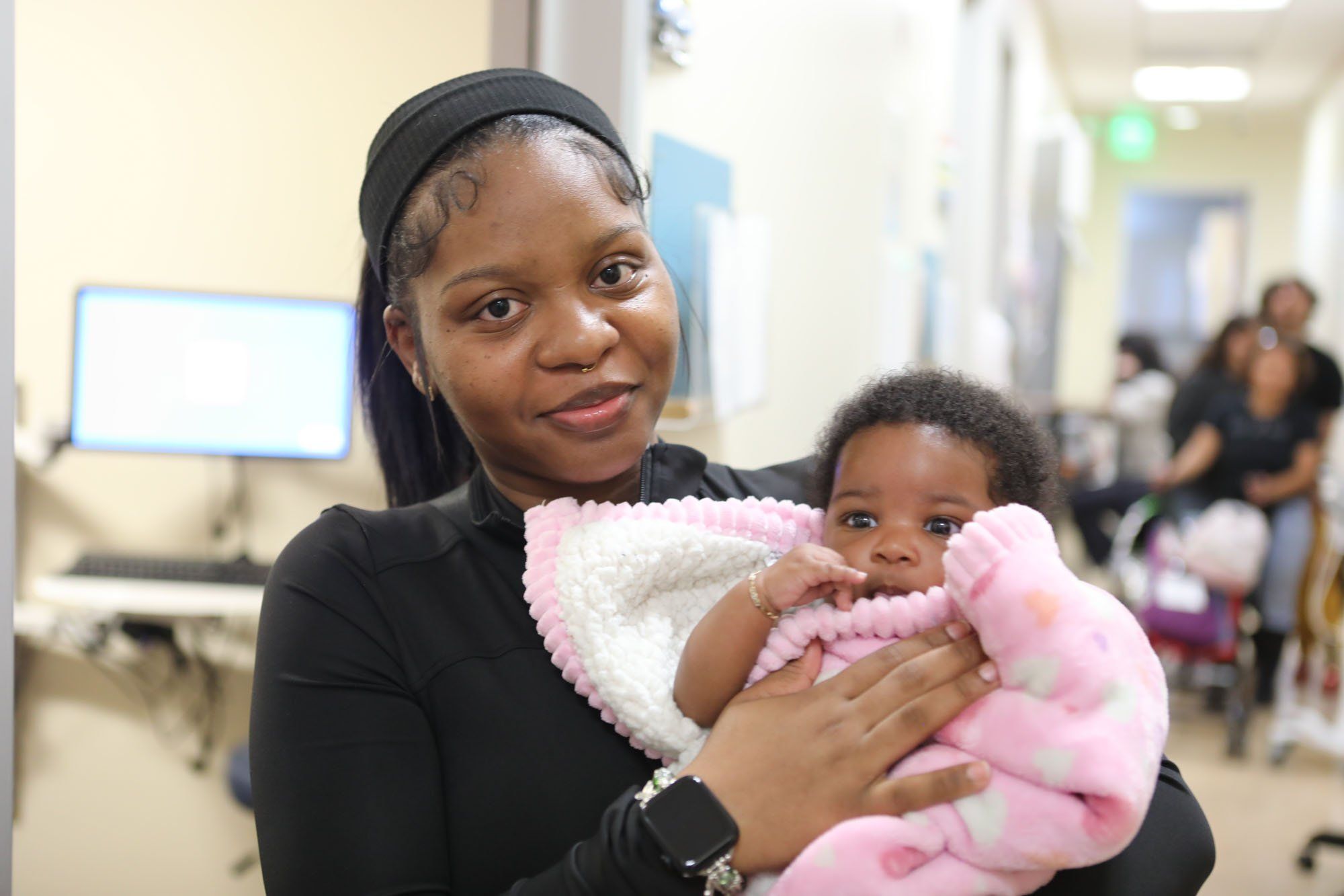 Black women at wellness center receiving holistic care